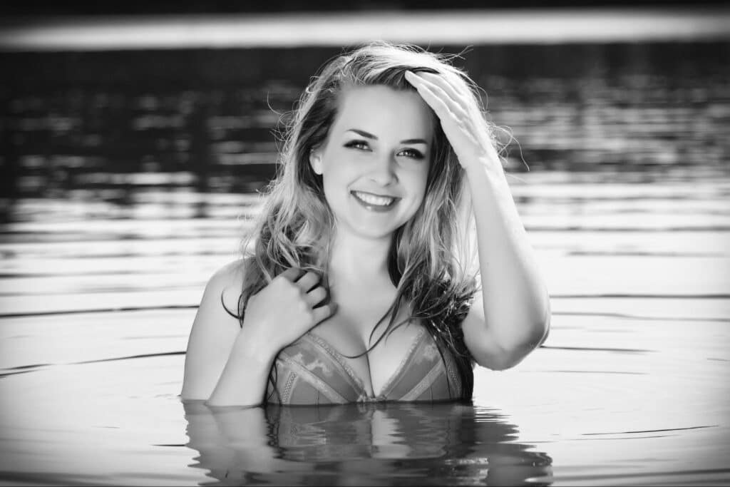 woman in the water touching her hair